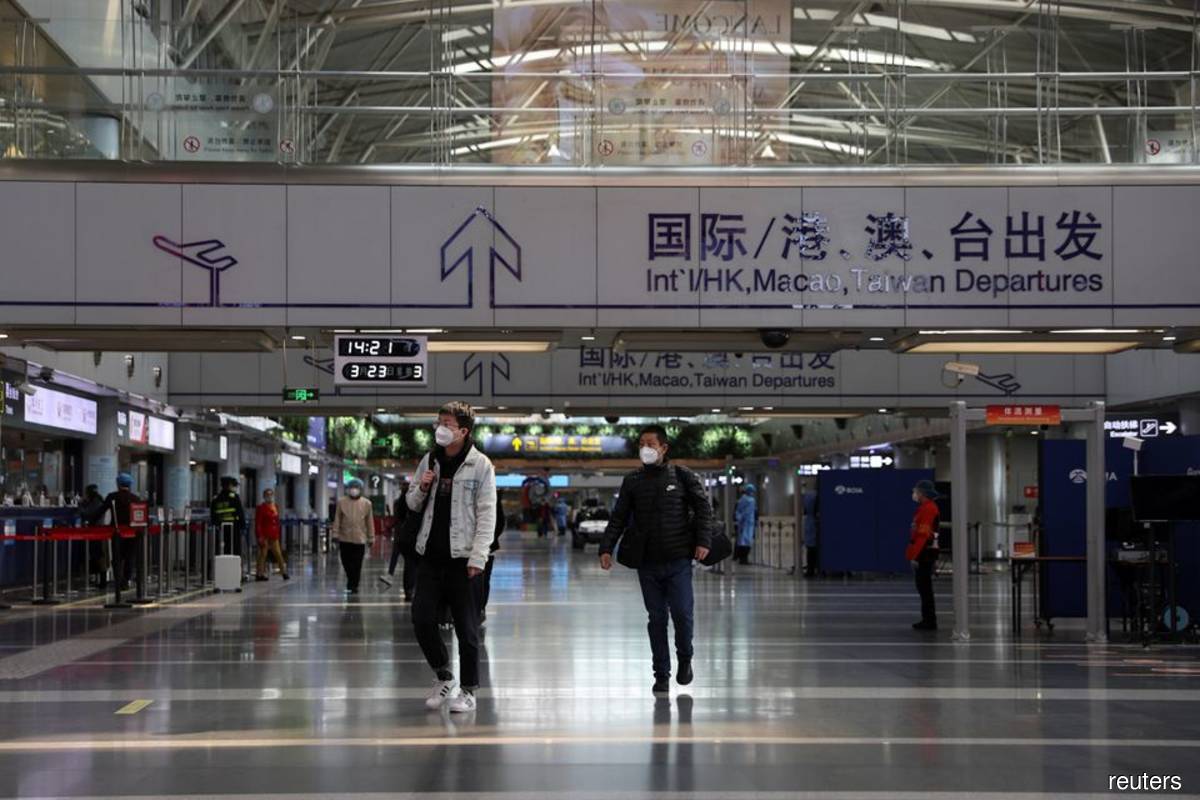 China airports see large-scale flight cancellations amid surge in Covid-19 cases — media